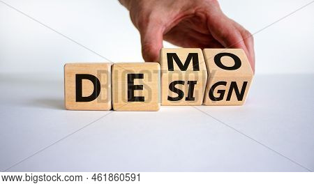 Demo And Design Symbol. Businessman Hand Turns Cubes And Changes The Word 'design' To 'demo'. Beauti