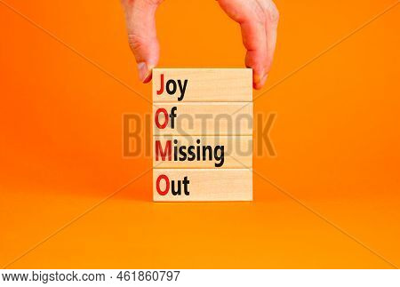 Jomo Joy Of Missing Out Symbol. Concept Words Jomo Joy Of Missing Out On Wooden Blocks On A Beautifu