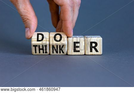 Doer Or Thinker Symbol. Concept Words Doer Or Thinker On Wooden Cubes. Businessman Hand. Beautiful G
