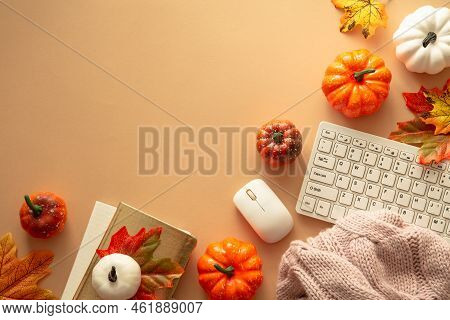 Autumn Office Workspace. Keyboard, Laptop, Notebok With Autumn Clothes And Fall Decorations - Pumpki