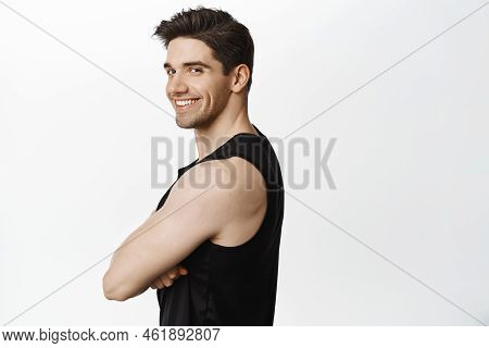 Handsome Strong Man With Mascules, Looking At Camera With Flirty Smile, Fitness Trainer Inviting To 