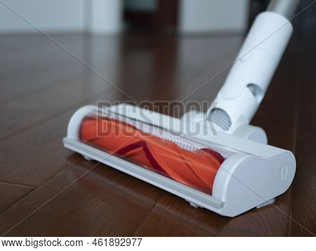 White Vacuum Cleaner With V-shaped Rotating Roller Head, Selective Focus. Concept Of Dry Cleaning, V