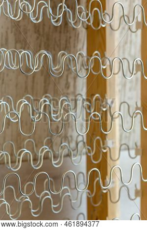 View Of Spring Shock Absorbers Stretched On A Frame Inside A Modern Soft Sofa.