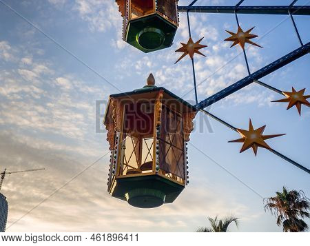 A Small Ferris Wheel In The Park. A Bright Attraction For Children. Entertainment In The Park. Color