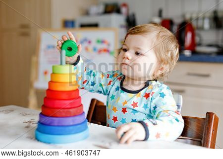 Cute Beautiful Little Baby Girl Playing With Educational Toys At Home Or Nursery, Indoors. Happy Hea