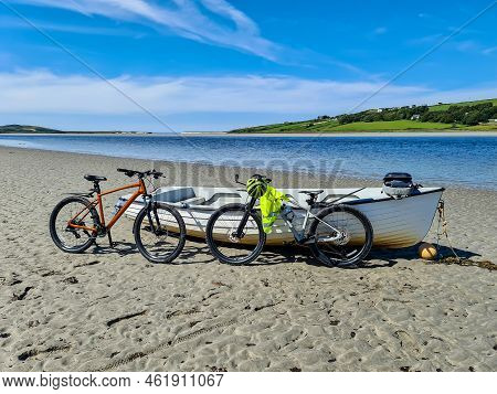 Concept Of Enjoying The Outdoors By Bicycle And Boat At Gweebarra Bay , County Donegal - Ireland