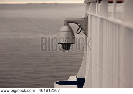 Camera At Railing On Large Ferry With Sunset In The Background