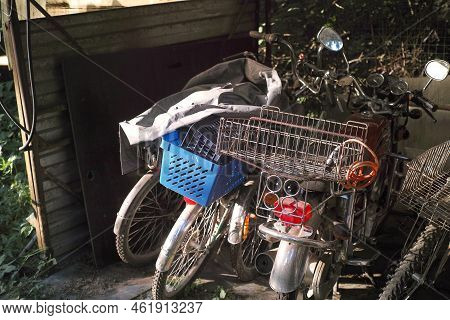 Collection Of Abandoned Delivery Bikes And Scotters, Outdor Shot