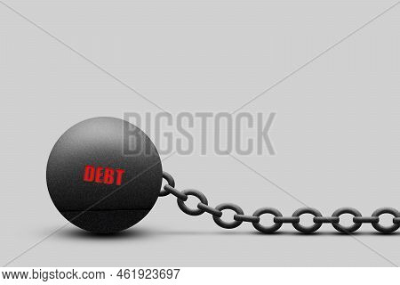 Kettlebell With A Chain, The Word Debt, On A Gray Background. Copy Space. The Severity Of Obligation