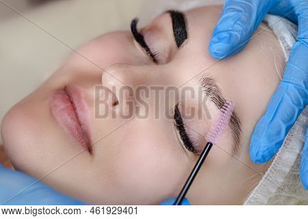 Beauty And Healthy Lifestyle Ideas. Young Beautiful Woman Having Permanent Make-up Tattoo On Eyebrow