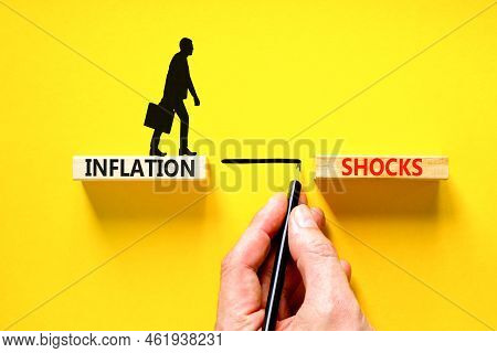Inflation Shocks Symbol. Concept Words Inflation Shocks On Wooden Blocks. Beautiful Yellow Table Yel