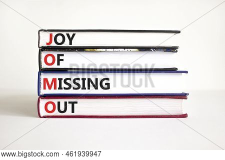 Jomo Joy Of Missing Out Symbol. Concept Words Jomo Joy Of Missing Out On Books On A Beautiful White 