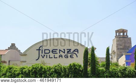 May 2022 Fidenza, Italy: Fidenza Village Shopping Center Logo Icon On The Building.