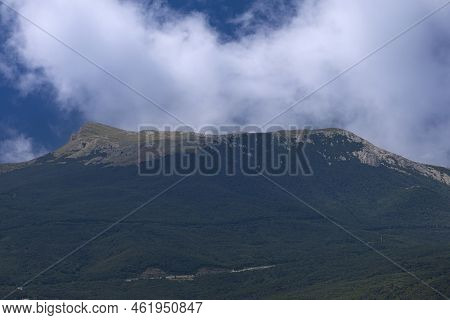 View Of Mount Chatyrdag Against The Background Of Clouds. Mountain Landscape