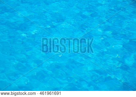 Closeup Surface Of Blue Clear Water With Small Ripple Waves In Swimming Pool.