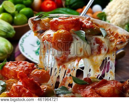Slice of pizza raised food, seafoos