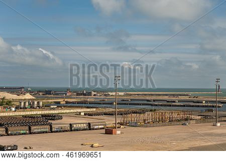 Europe, France, Dunkerque - July 9, 2022: Port Scenery Quay 6. Stored Steel Plate Roles With Train W