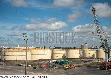 Europe, France, Dunkerque - July 9, 2022: Port Scenery. Group Of Large Beige Cylindrical Petroleum T