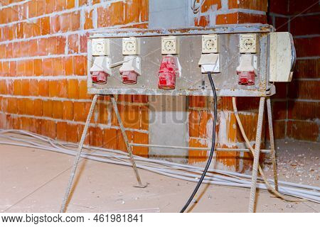 Distribution Panel With Industrial Multiphase Power Plugs And Sockets Are Providing Electrical Energ