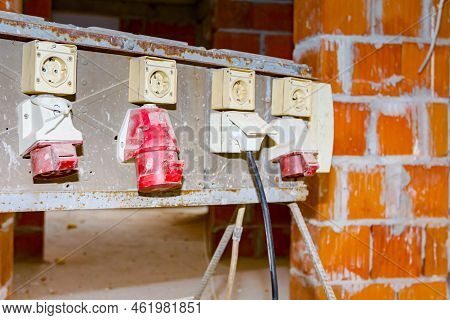 Distribution Panel With Industrial Multiphase Power Plugs And Sockets Are Providing Electrical Energ