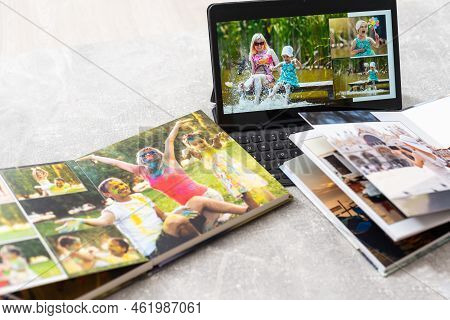 Photobook Album And Tablet On The Table