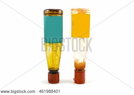 Soy Sauce And Ketchup Bottles Overturned Because They Were Almost Empty Isolated On White Background