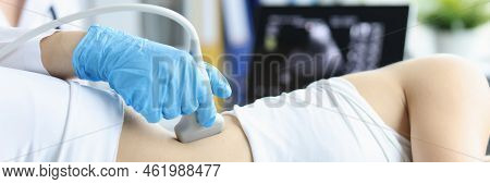 Doctor Making Ultrasound Of Kidneys To Patient In Clinic Closeup. Diagnosis And Treatment Of Urolith