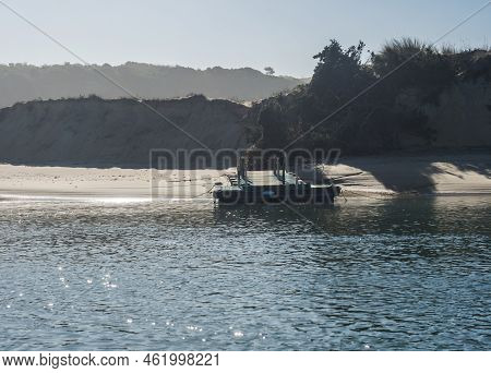 View Of Praia Das Furnas Sand Beach With Small Turquoise Wooden Boat Dock, Pier For Ferry Boats Acro