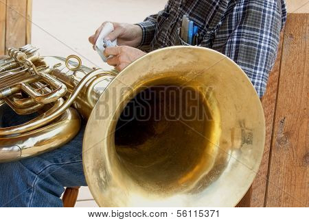 Man Cleaning Tuba