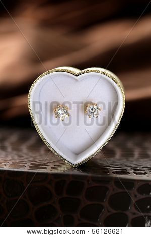 gold earrings stud with diamonds macro shot