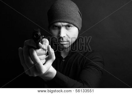 Portrait of a man holding gun