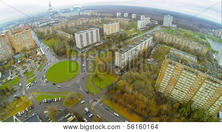 District with road roundabout on green square, view from unmanned quadrocopter.