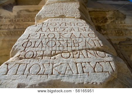 Antique letters on a column. Ephesus. Turkey