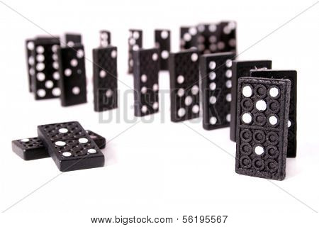 A line of black dominoes. All isolated on white background.
