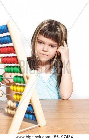 A young girl learning maths by using a sliding rule. All isolated on white background