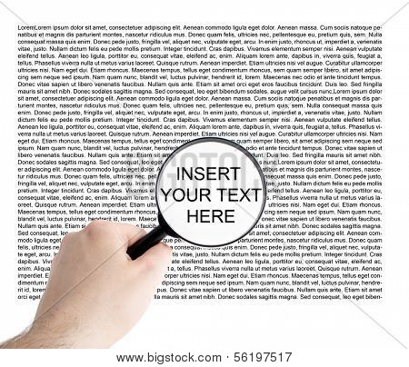 A person trying to read the small print by using a magnifier.