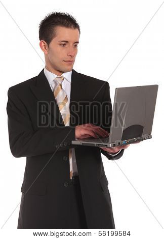 A handsome businessman using a notebook computer. All on white background.