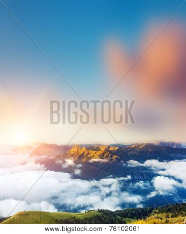Great view of the foggy Val di Fassa valley with passo Sella. National Park. Dolomites, South Tyrol. Location Canazei, Campitello, Mazzin. Italy, Europe. Dramatic scene. Beauty world.