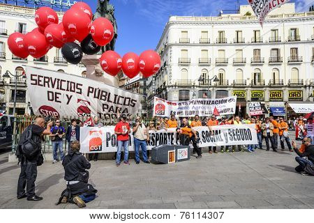 MADRID, SPAIN - OCTOBER 17, 2014: Crowds at Puerta del Sol Plaza protest the privatization of state-owned airport operator Aena Aeropuertos. The plan has met much opposition.