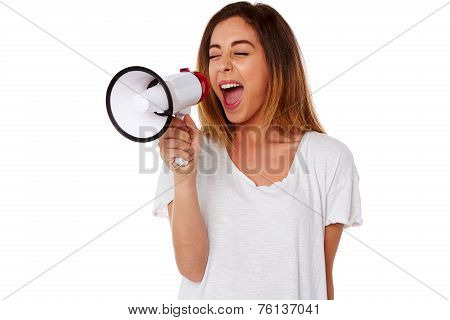 Angry Young Woman Yelling Into A Megaphone