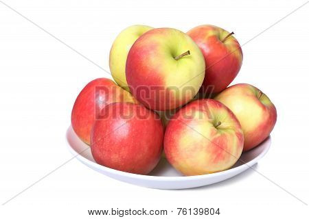 A Dish Full Of Fresh Apples Isolated On A White Background