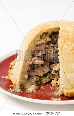 Chicken and mushroom suet pudding, steamed in a a basin, and old-fashioned English speciality