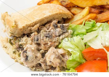 Chicken and mushroom suet pudding, steamed in a a basin, and old-fashioned English speciality