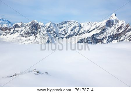 Plateau Rosa in Cervinia ski resort: the highest skiable slope in Italy (3480 mt). In background the snowy peak next Matterhorn. Valle d'Aosta, Italian Alps, Europe.