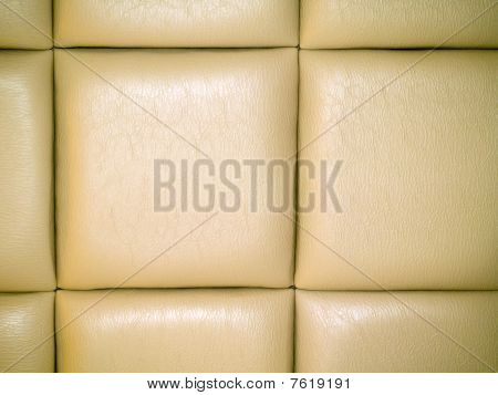 Fond capitonnés en cuir beige pâle avec un motif répétitif