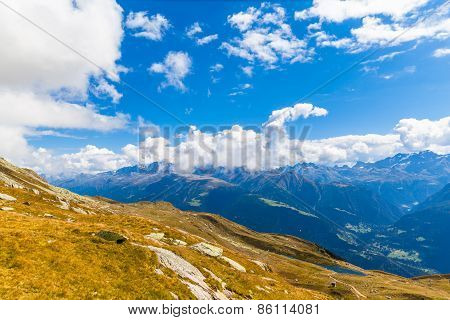 Bettmersee (lake) And The Alps In Valais
