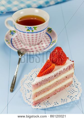 A Piece Of Strawberry Cake With A Cup Of Tea