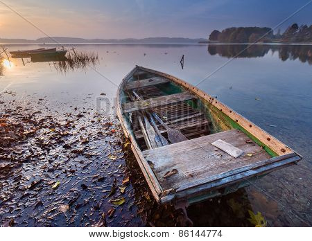 Sunset Lake With Fisherman Boat Landscape.