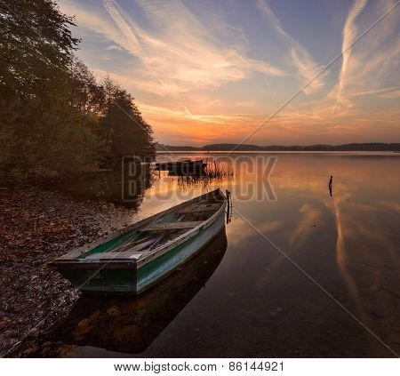 Sunset Lake With Fisherman Boat Landscape.