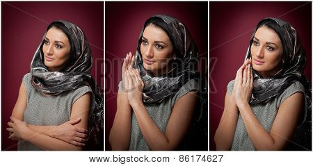 Attractive brunette woman in gray blouse and headscarf posing dramatic on purple background